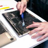 Detailed Laptop Maintenance with Brush Cleaning on Motherboard Detailed Laptop Maintenance with Brush Cleaning on Motherboard