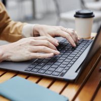 Hands of young businesswoman or solopreneur typing on laptop keyboard Hands of young businesswoman or solopreneur typing on laptop keyboard