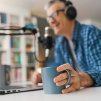 Professional speaker recording a live podcast Professional speaker recording a live podcast